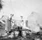 Women Cooking at Outdoor Fire Pit