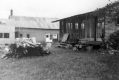 Stacks of Lumber Near Houses
