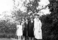 Family in front of trees