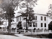 Boy in Front of a House