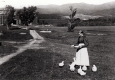 Woman Feeding Chickens