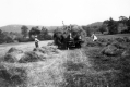 Farmers loading Hay onto Horse Team