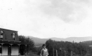 Woman Near Rural Home