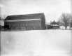 Barn and home in a snowy scene