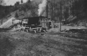 Wooden shack with smoking chimney
