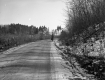 Woman walking along rural road