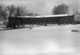 Winter scene with covered bridge