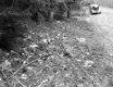"Danger Highway Construction" Sign with Garbage on Ground