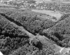 Aerial of forested hill and Norwich University