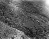 Aerial of pastures and forested area