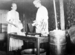 Abbie and Nelson Whitehill making butter