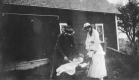 Two women and baby in carriage