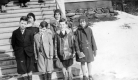 Six children standing at bottom of stairs at East Barnet Chapel