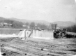 Timber on dam near waterfall