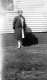 Woman on the side of a house