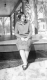Woman sitting on porch