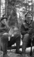 Two Men Rest in a Forest