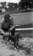 A Man Watches a Hunting Dog