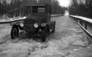 A Car on a Flooded, Icy Road