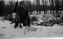 A Hunter with Rifles and Rabbits