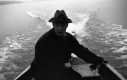 A Man in Rowboat with Motor