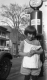 Girl and Gasoline Pump