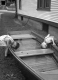 Boys Play in a Boat