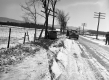 Flipped Car on a Snowy Road
