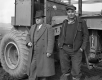 Smith and Orvis in Front of a Tractor