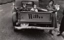 Women and girls with a truck.