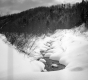 Stream Flowing Through Snow