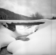 Wooden Bridge Over Running Stream