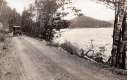 Car Driving along Lake 