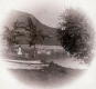 Women and Girl Sitting by Lake