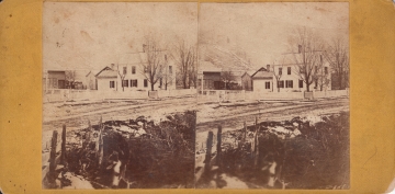 Wood Framed House along a Dirt Road 