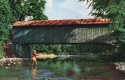 Fly fishing near covered bridge