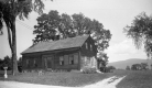 Wooden-frame building and vista 