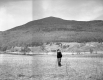 A man in front of Potato Hill