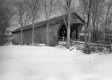 A covered bridge in the winter