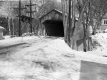 Wooden covered bridge in the winter