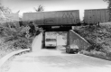 Train running across an overpass