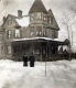 Couple in Front of Home
