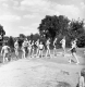 Children lined up in bathing suits