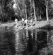 Chidren on a pond