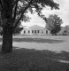 Stone Building and deciduous trees