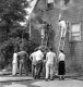 Two ladders against a smoking house