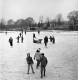 Children skating on a frozen pond