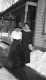 Women in Front of a House