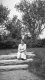 Woman Sitting on Stone Steps