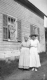 Two Women In Front of Home